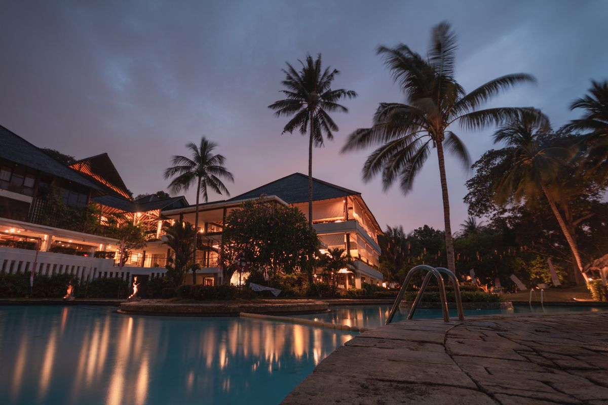 Hotel resort pool glowing at dusk